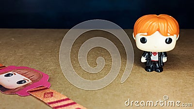 Ron Weasley toy and Hermione Granger bracelet. Editorial Stock Photo