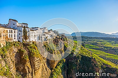 Ronda, Spain: Landscape of white houses on the green edges of steep cliffs Stock Photo