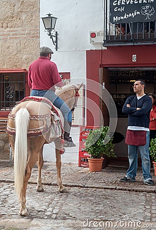 Man riding horse on street of Ronda, Spain Editorial Stock Photo