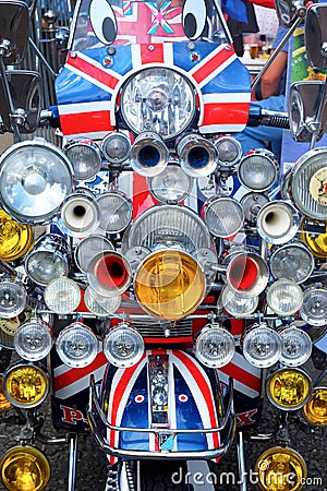 The ront of a moped scooter with 20 head lights and union jack flag Editorial Stock Photo