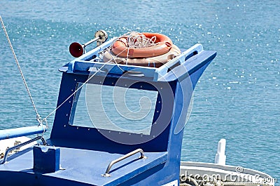 Roof of a blue boat with orange lifebuoys Stock Photo