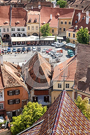 Roof of the Cathedral of Saint Mary and view of The Small Square Piata Mica, Sibiu, Romania Editorial Stock Photo