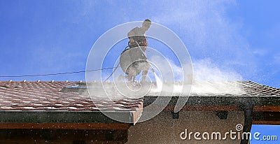 Roof cleaning with high pressure cleaner Stock Photo