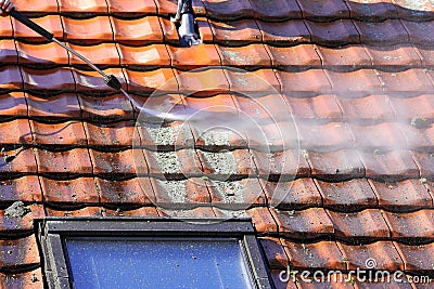 Roof cleaning with high pressure Stock Photo