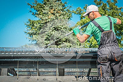 Roof and Gutters Cleaning Stock Photo