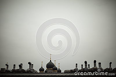 Roof of house and Orthodox cross. View of roof in city. Russian city in detail. Pipes on building Stock Photo
