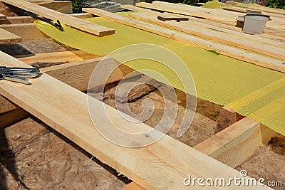 Roof Insulation Renovation Details. House Roof Thermal Insuation with Mineral Wool and Vapor barrier Stock Photo