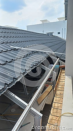 roof repair in hot sun Stock Photo