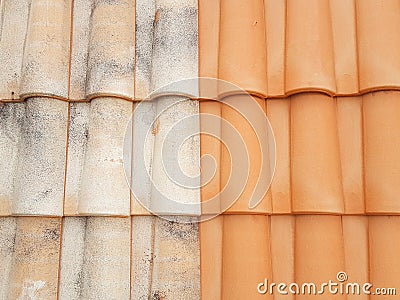 Before after roof restauration tiles half clean and dirty after the passage of a high-pressure jet Stock Photo