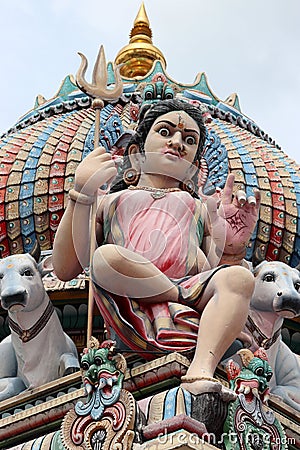 A colored Hindu deities on the roof of Sri Mariamman Hindu temple in Chinatown Singapore Stock Photo