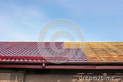 Roof roofing, repair, replacement of metal tiles Stock Photo