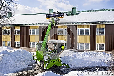 Roof Shoveling Editorial Stock Photo