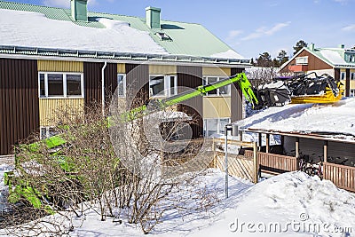 Roof Shoveling Editorial Stock Photo