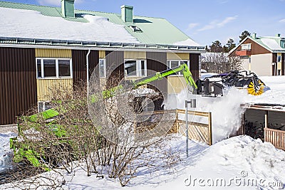 Roof Shoveling Editorial Stock Photo