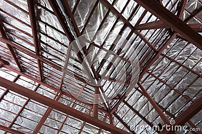 Roof with steel beam and silver foil insulation heat Stock Photo