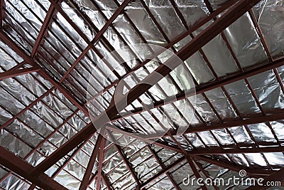 Roof with steel beam and silver foil insulation heat Stock Photo