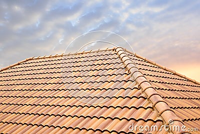 Roof tiles and sky sunlight.Roofing Contractors concept Installing House roof. Stock Photo