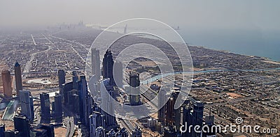 Roof view on Dubai from the 154th floor of the Burj Khalifa Editorial Stock Photo