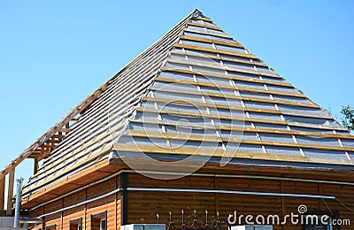 Roof Waterproofing Membrane Coverings Wooden Construction Home Framing with Roof Rafters. Stock Photo