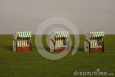 Roofed wicker beach chair Stock Photo