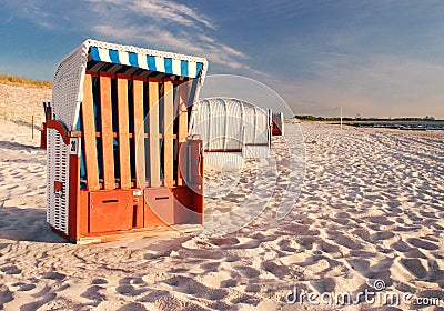 Roofed wicker beach chair on the beach, baltic sea and soft sand Stock Photo