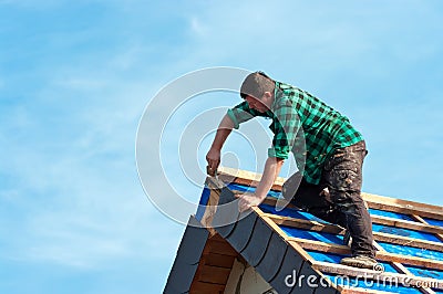 Roofer Attaching Shingles Stock Photo