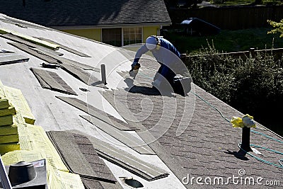 Roofer fixing roofing new roof Editorial Stock Photo