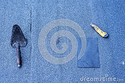 Roofer making repairs of the roof, Stock Photo