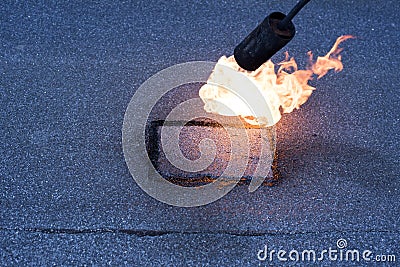 Roofer making repairs of the roof, Stock Photo