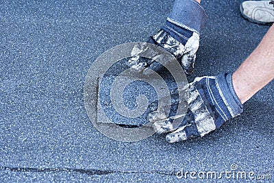 Roofer making repairs of the roof, Stock Photo