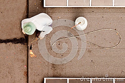 Roofer using propane torch to repair flat roof Stock Photo