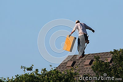 Roofer Working Walks on Peak Editorial Stock Photo