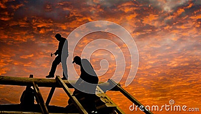 Roofers build cabin roof at dusk Editorial Stock Photo