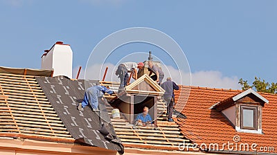 Roofers on the roof. Editorial Stock Photo