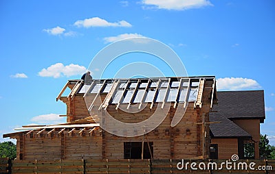 Roofing Construction and Building New Wooden House Exterior. Con Stock Photo