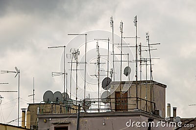 Roofs of houses full of TV antennas, satellite dishes Stock Photo