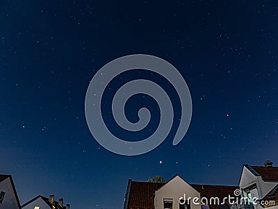 Starry sky in cloudless weather in the city Stock Photo