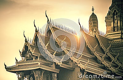 Roofs in Thai architecture kind of temple palace over sunset or sunrise. Building religion in Thailand Stock Photo