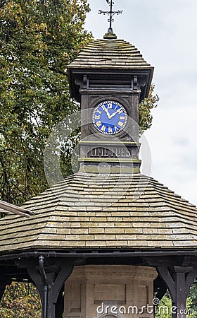 The rooftop tower of an old wooden round Gazebo with the legend Editorial Stock Photo