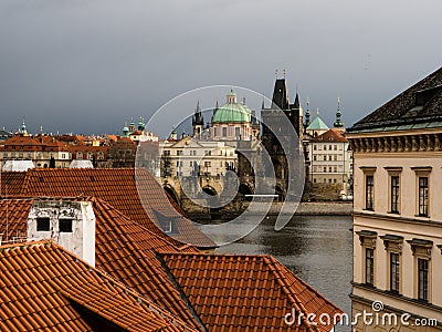 Rooftops of Mala Strana neighborhood with view of Charles Bridge in Prague Stock Photo