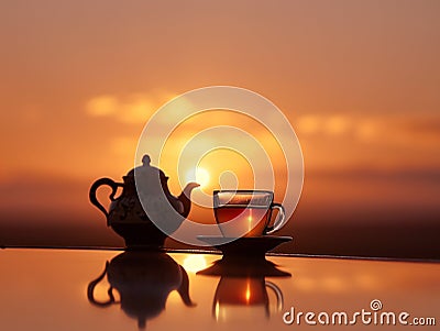 a Rooibos tea set against the backdrop of a South African sunset Stock Photo