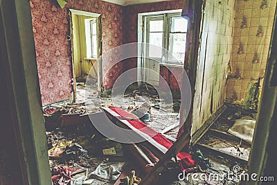 Room in abandoned house, habitation of homeless people Stock Photo