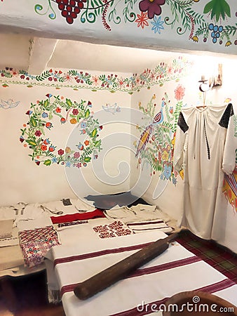 a room in an ancient Ukrainian house with painted walls and embroidered towels Stock Photo