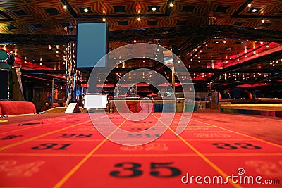 Room in casino with table for roulette game Stock Photo