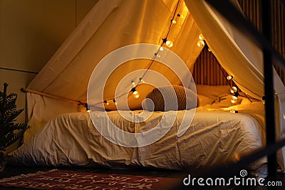 room of children empty tent lodge in the evening before going to bed. Stock Photo