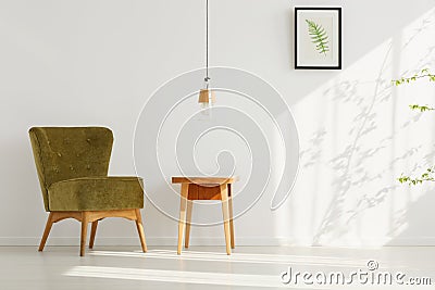 Room with comfortable green chair Stock Photo
