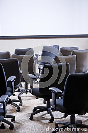 Room full of empty office chairs Stock Photo