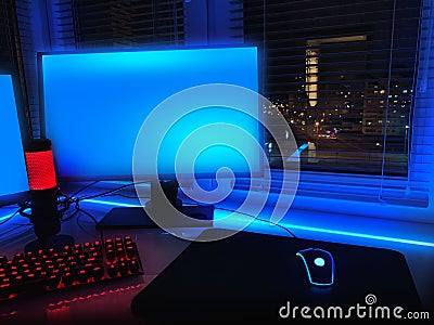 Room with neon lights. Game Zone. Interior for computer games, game sports and stream. Abstract neon background in the interior. N Stock Photo