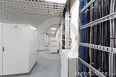 Room with rows of racks with equipment for telecom Stock Photo
