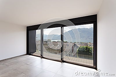 Room with black window overlooking Lake Maggiore Stock Photo